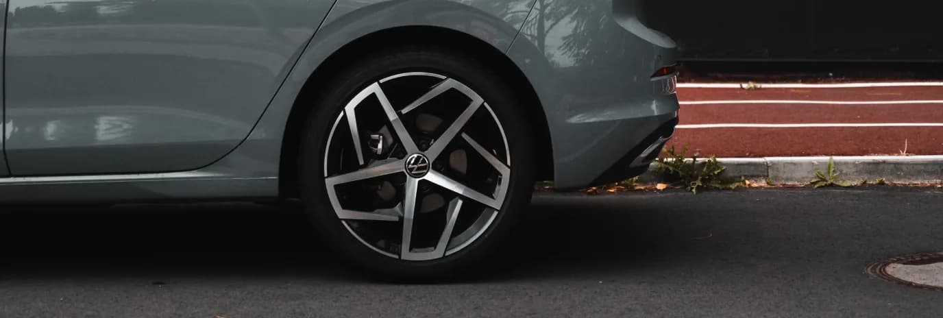A close photograph of a car's alloy wheel