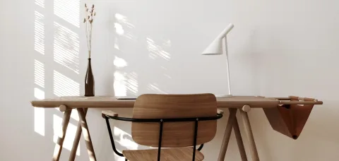 A writing desk by a sunlit window